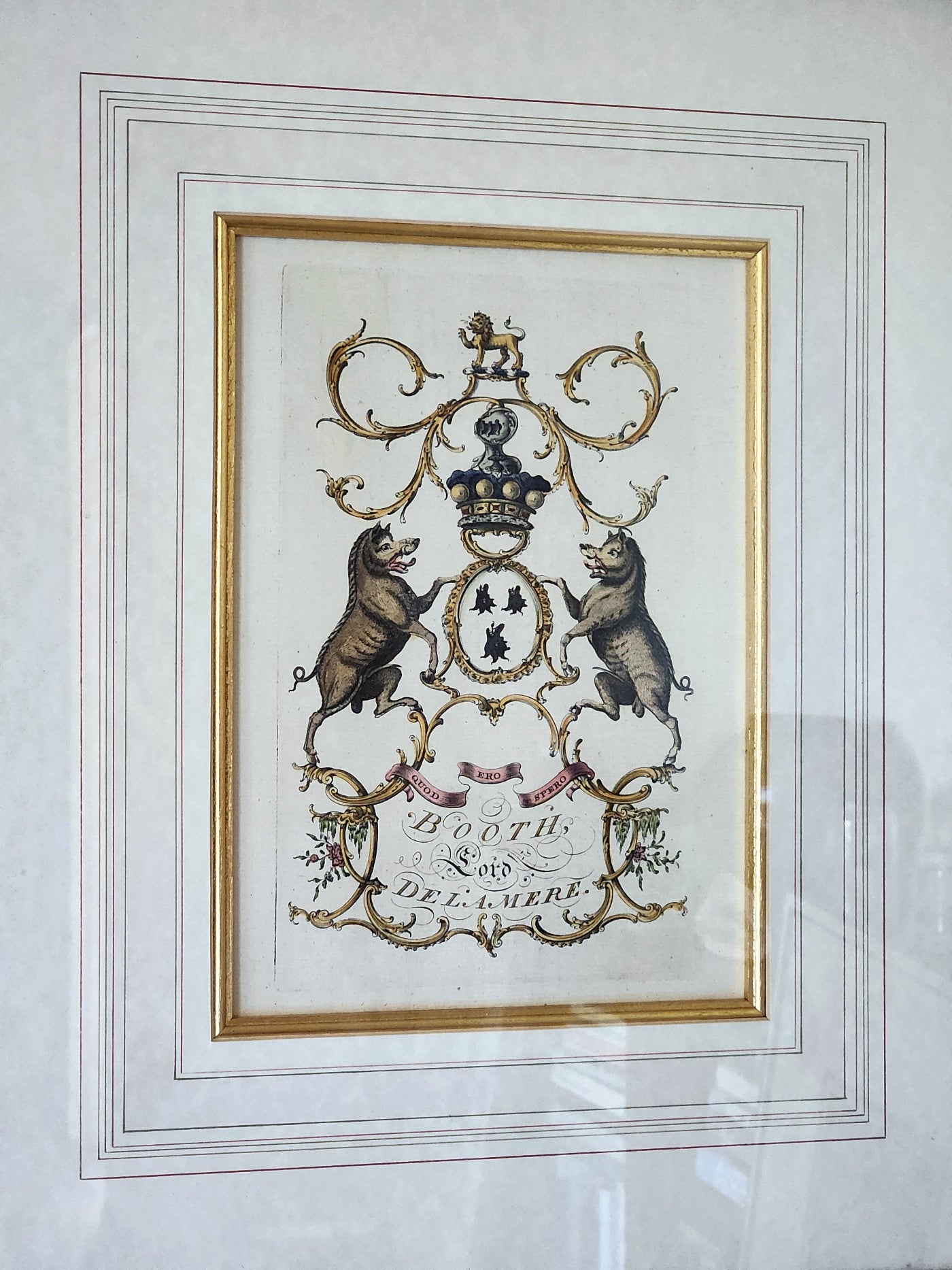Decorative coat of arms with bears and a crown in a gold frame on a white background